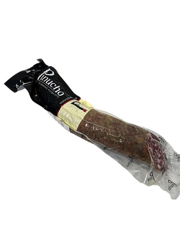 Corte de salchichón extra ibérico de bellota Pinucho textura carnosa veta grasa nacarada Guijuelo