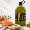 Garrafa de AOVE Hojiblanca ecológico Antojo del Sur junto a tostadas con tomate y aceite de oliva