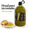 Garrafa de AOVE ecológico Picual Antojo del Sur junto a pan y un cuenco de aceite